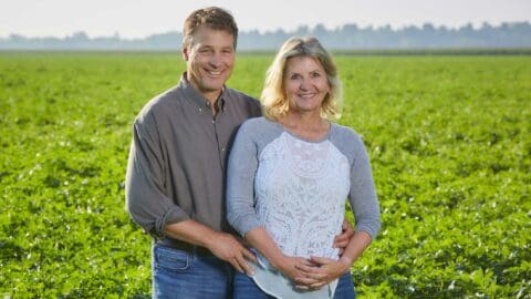 Nuto Farms parents standing in potato field