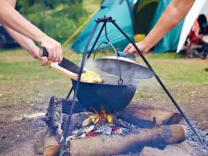 Cooking potatoes over a  campfire