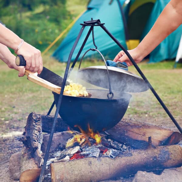 Cooking potatoes over a campfire