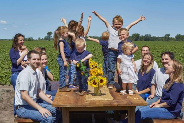 Wysocki Family of Companies family having fun at picnic table in the field